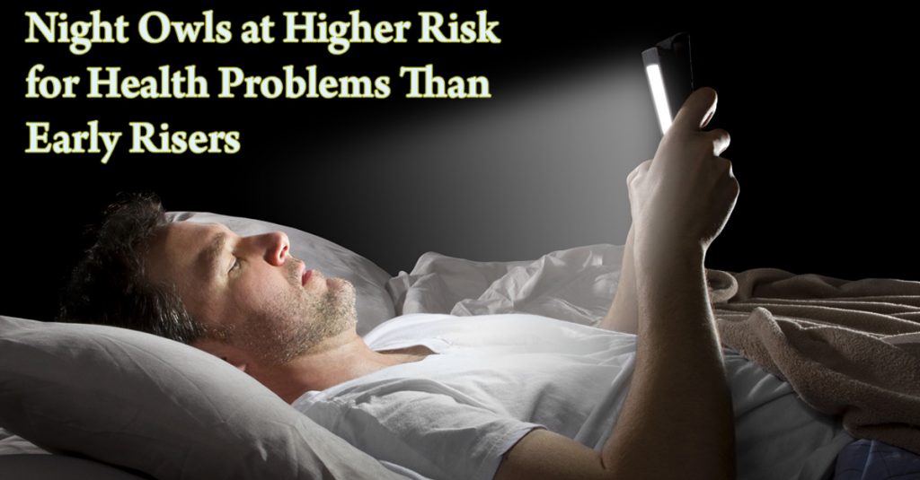 A Caucasian man lying in bed holding up and looking at a tablet screen with text "Night Owls at Higher Risk for Health Problems Than Early Risers"