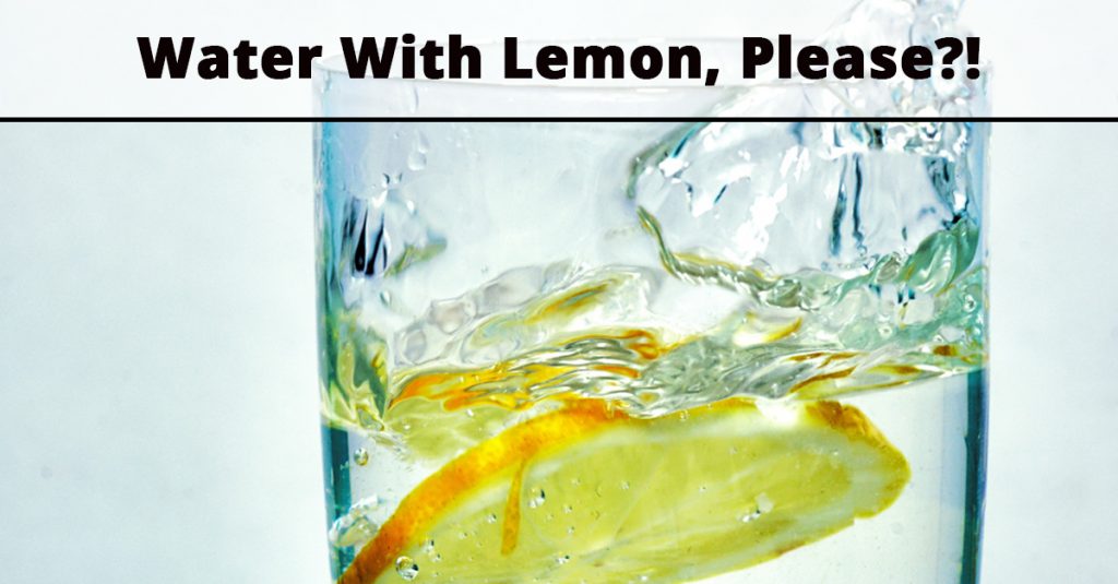 The top half of a glass of lemon water with text "Water With Lemon, Please?!"