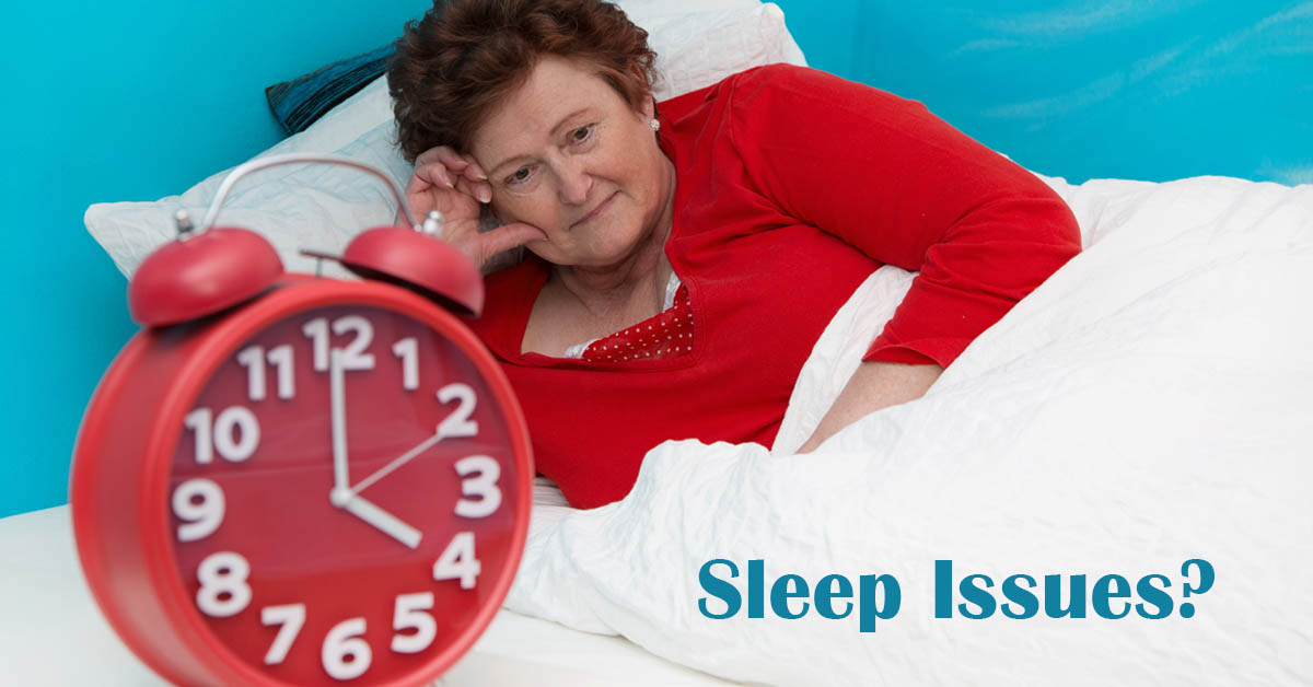 Connection Found Between Sleep issues and Elevated Stroke Risk. Picture of an older caucasian female sitting up in bed unable to sleep.